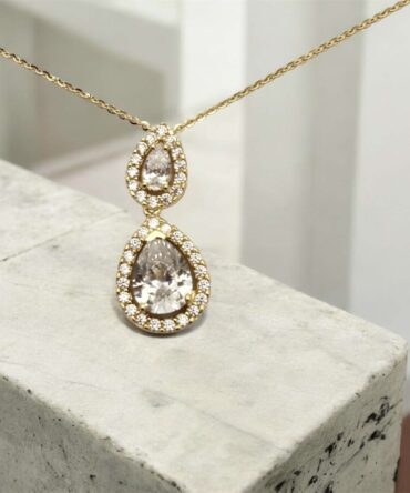 Χρυσό μενταγιόν σε σχήμα δάκρυ με πέτρες ζιργκόν ,κ9