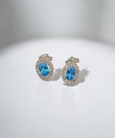 Λευκόχρυσα σκουλαρίκια ροζέτες πάνω στο αυτί με γαλάζιες πέτρες ζιργκόν , κ9