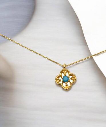 Χρυσό μενταγιόν στυλ Van cleef με γαλάζια πέτρα ζιργκόν , κ14