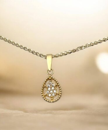 Χρυσό μενταγιόν σε σχήμα δάκρυ με πέτρες ζιργκόν ,κ9