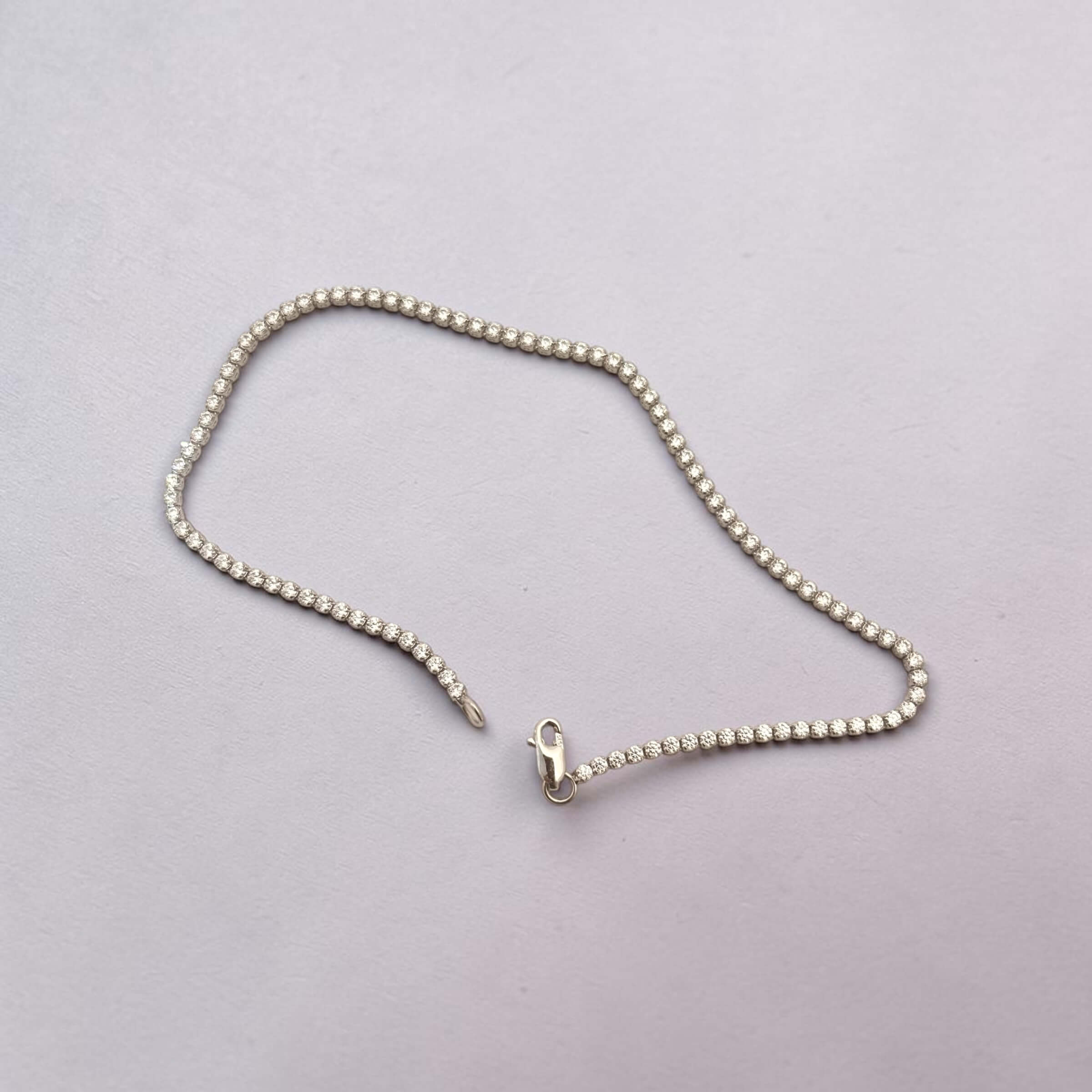 Λευκόχρυσο γυναικείο βραχιόλι tennis bracelet με πέτρες ζιργκόν , κ14